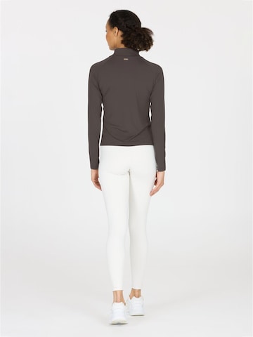 Athlecia Functioneel shirt 'Grina' in Bruin