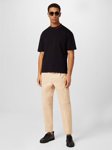 Tapered Pantaloni chino di Tommy Jeans in beige