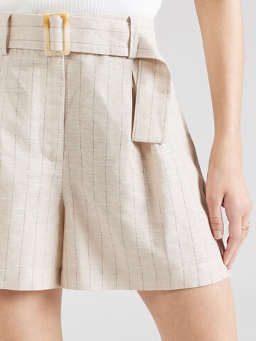 regular Pantaloni con pieghe 'Tara ' di ABOUT YOU x Iconic by Tatiana Kucharova in beige