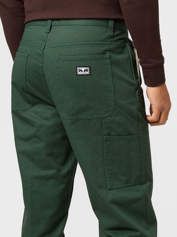 Obey Normalny krój Spodnie w kant w kolorze zielony