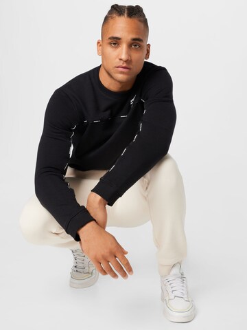 Reebok - Sweatshirt de desporto em preto