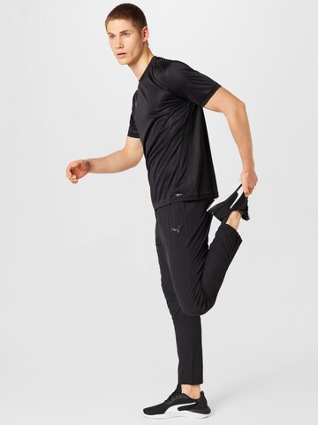 PUMA - Tapered Pantalón deportivo 'Ultraweave' en negro