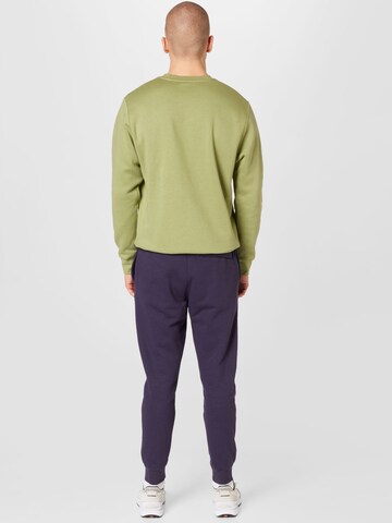 Nike Sportswear Tapered Trousers 'Club Fleece' in Purple