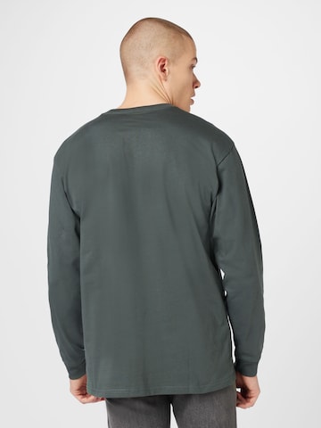 Carhartt WIP T-shirt 'Chase' i grå