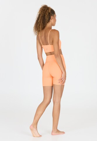 Athlecia Regular Sportbroek 'Bloom' in Oranje