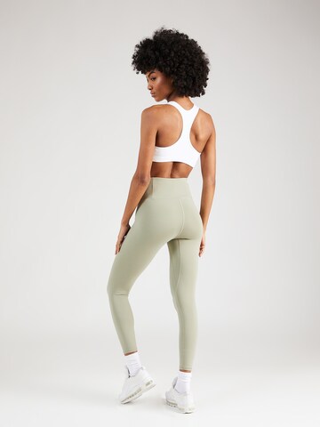 Skinny Pantaloni sport 'Motion' de la UNDER ARMOUR pe verde