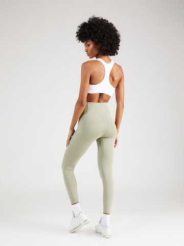 UNDER ARMOUR Skinny Sportovní kalhoty 'Motion' – zelená