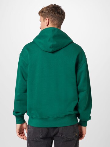 LEVI'S ® Regular Fit Collegepaita 'Relaxed Graphic Hoodie' värissä vihreä