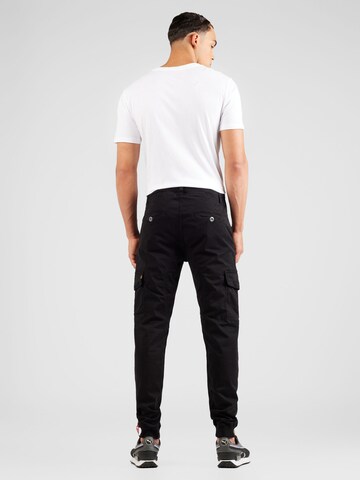 Effilé Pantalon cargo 'Spark' ALPHA INDUSTRIES en noir