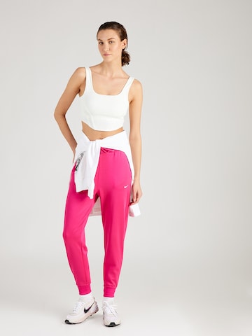 Effilé Pantalon de sport 'ONE' NIKE en rouge