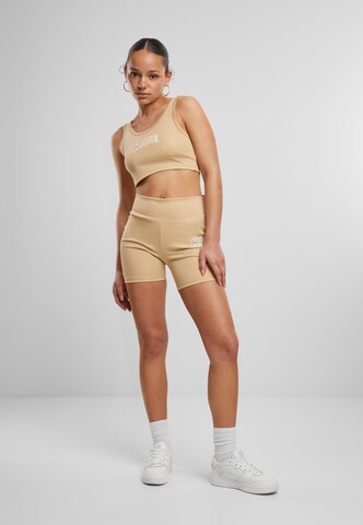 Skinny Pantalon de sport Karl Kani en beige