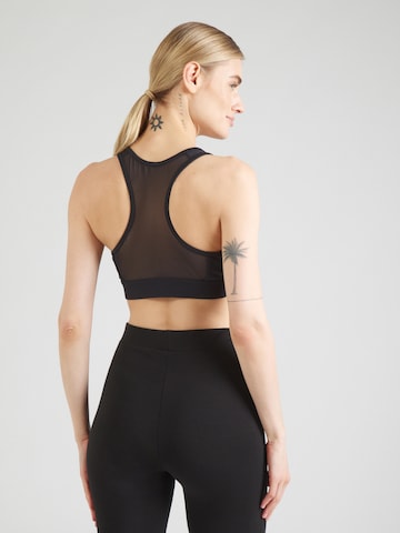 Bustino Reggiseno sportivo di 4F in nero: dietro