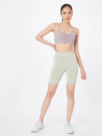 Skinny Pantalon de sport PUMA en vert