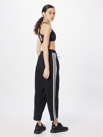 ADIDAS SPORTSWEAR Loose fit Sports trousers 'Essentials' in Black