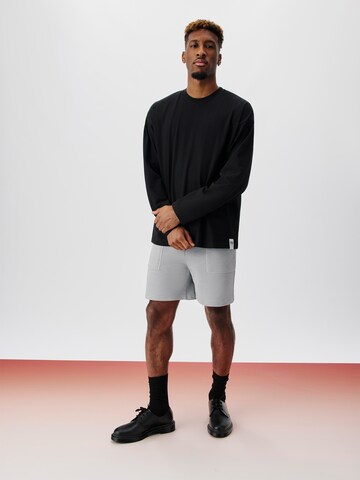 ABOUT YOU x Kingsley Coman Loose fit Pants 'Nathan' in Grey