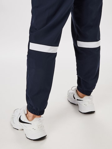 NIKE Tapered Sportbroek in Blauw