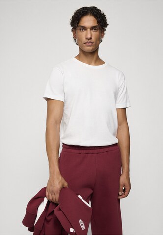 Tapered Pantaloni di Unfair Athletics in rosso