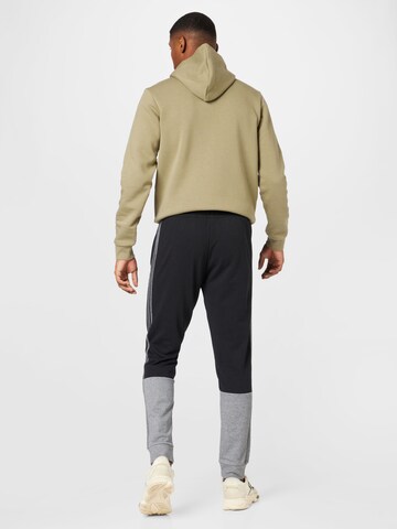 juoda ADIDAS SPORTSWEAR Siaurėjantis Sportinės kelnės 'Essentials Mélange French Terry'