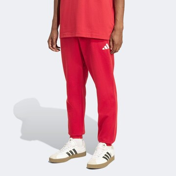 ADIDAS SPORTSWEAR Tapered Workout Pants in Red: front