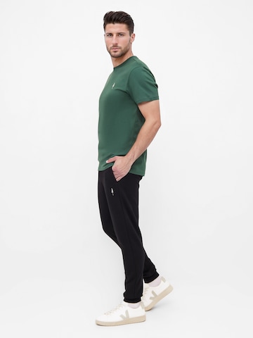 NIKIN Tapered Trousers 'Tree' in Black