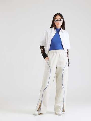 Nike Sportswear Široký strih Nohavice - Béžová