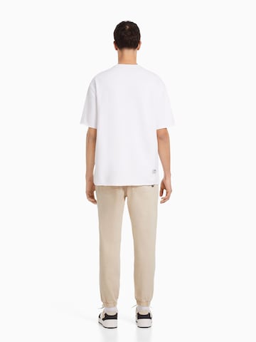 Bershka Tapered Farkut värissä beige