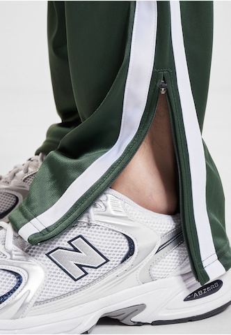 Loosefit Pantaloni sportivi 'DMWU Evolution' di Unfair Athletics in verde