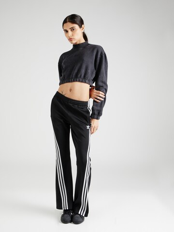 Evazați Pantaloni de la ADIDAS ORIGINALS pe negru