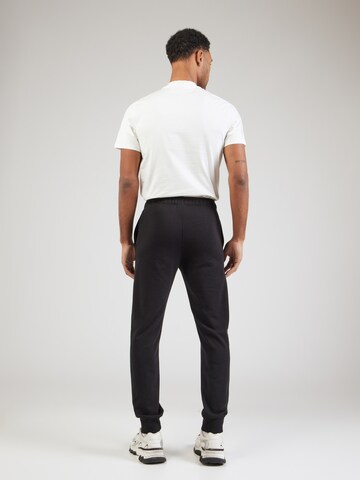 Champion Authentic Athletic Apparel Tapered Trousers in Black
