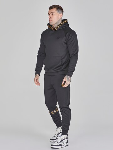 Effilé Pantalon de sport SikSilk en noir