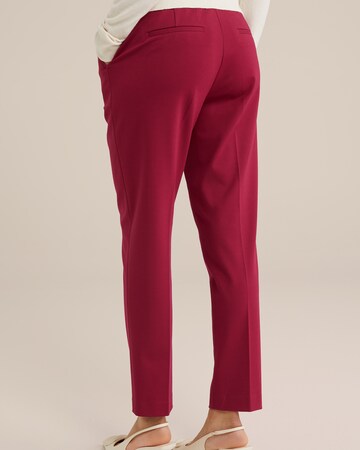 Slimfit Pantaloni con piega frontale di WE Fashion in rosso
