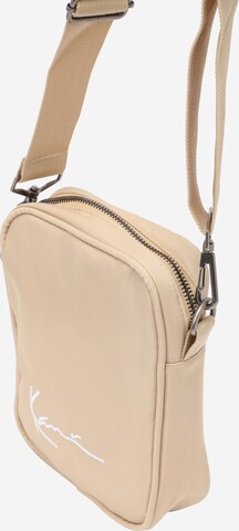 Sac à bandoulière Karl Kani en beige : devant