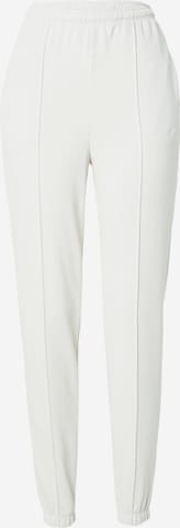 Nike Sportswear Tapered Trousers in White: front