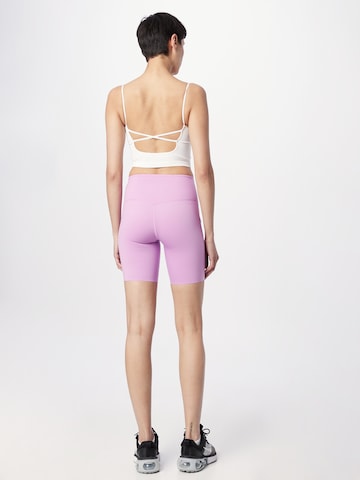 NIKE Skinny Spodnie sportowe w kolorze fioletowy
