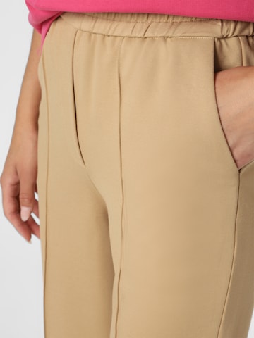 Ipuri Boot cut Pleated Pants in Beige