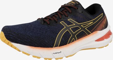 Chaussure de course ASICS en bleu : devant