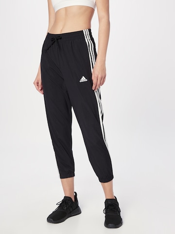 ADIDAS SPORTSWEAR - Tapered Pantalón deportivo 'Essentials 3-Stripes' en negro: frente