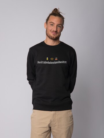 Watapparel Sweatshirt 'Dositzndedodeoiweidositzn' in Zwart: voorkant