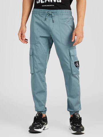 Calvin Klein Jeans Ozke Kargo hlače | modra barva: sprednja stran
