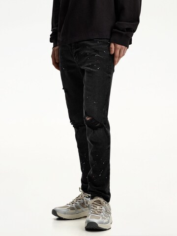 Bershka Skinny Jeans in Black: front