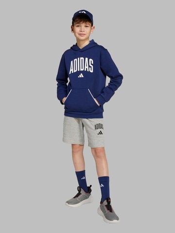 ADIDAS SPORTSWEAR - Camiseta deportiva en azul