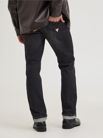 GUESS Slimfit Jeans 'Finnley' in Schwarz