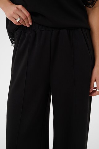 SAINT TROPEZ - Loosefit Pantalón plisado 'Umila' en negro