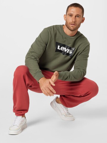 LEVI'S ® Zúžený Kalhoty 'Levi's® Unisex Fleece Jogger' – červená
