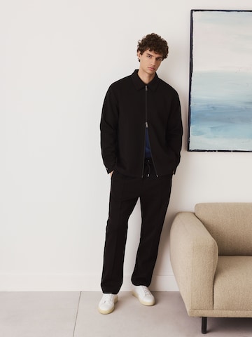 melns Next Standarta Bikses