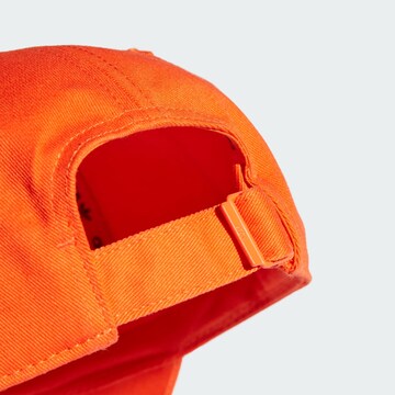 Cappello da baseball di ADIDAS ORIGINALS in arancione