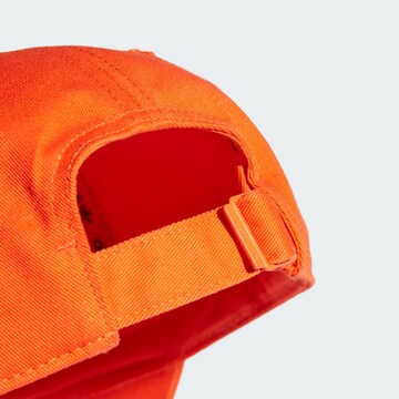 ADIDAS ORIGINALS Cap in Orange