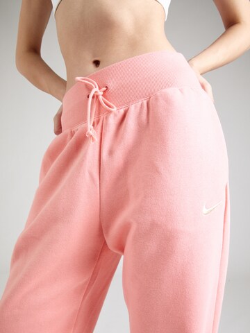 Nike Sportswear Zúžený Kalhoty 'Phoenix Fleece' – oranžová
