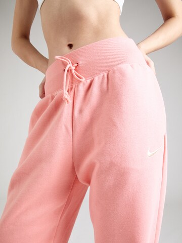 Tapered Pantaloni 'Phoenix Fleece' di Nike Sportswear in arancione