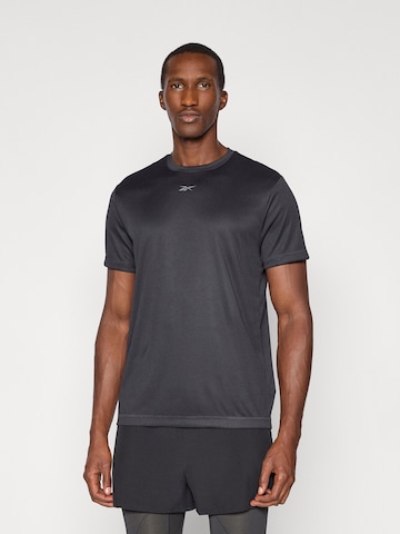 Reebok - Camisa funcionais 'ID TRAIN' em preto: frente